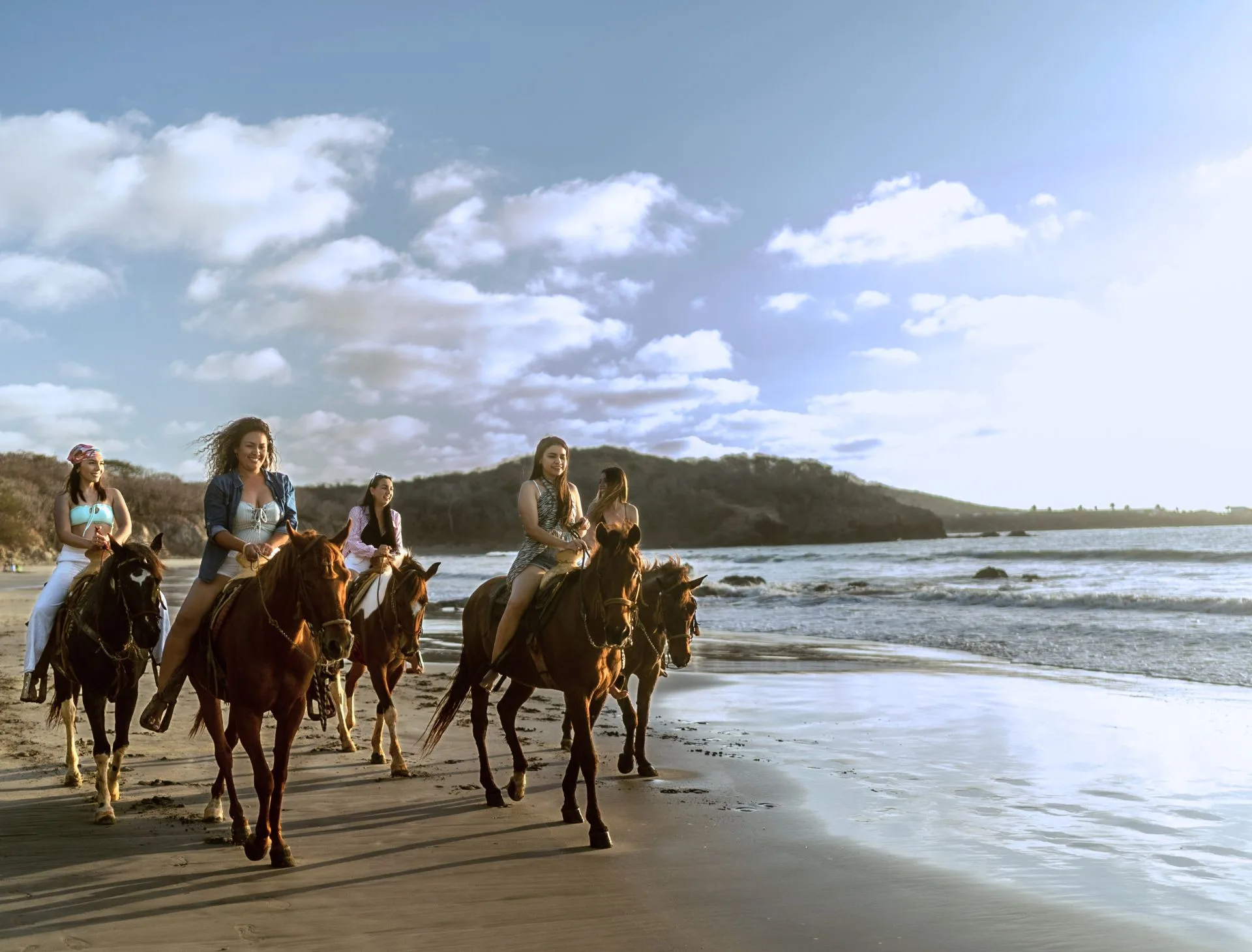 Wild Paso Fino horses grazing on the beach beside Blue Horizon Boutique Resort