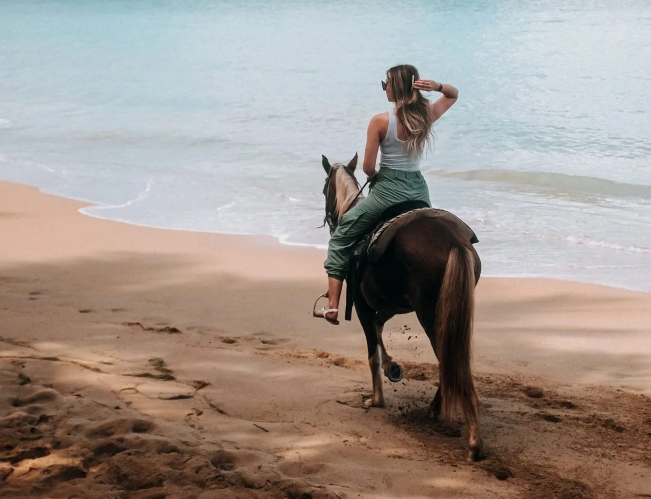 Riding horses along the beach at sunset in Vieques, Puerto Rico