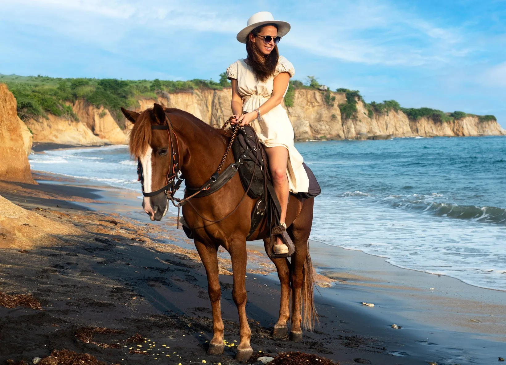 Horseback riding along the beach at sunset in Vieques